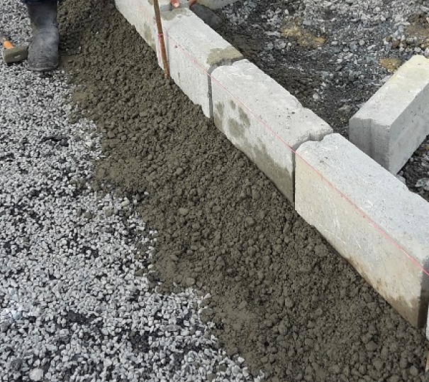 Bricks laid atop gravel.